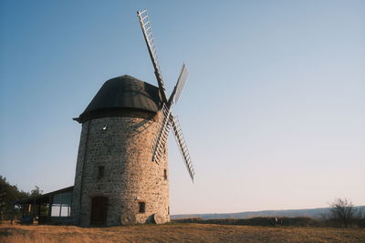 Built structure on field against clear sky