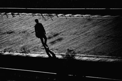 Silhouette man against sky