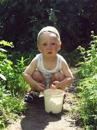 Portrait of boy eating food in bowl