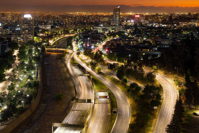 High angle view of illuminated cityscape at night