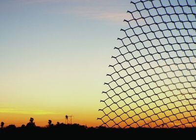 Silhouette of built structure at sunset