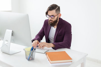 Full length of man working on table