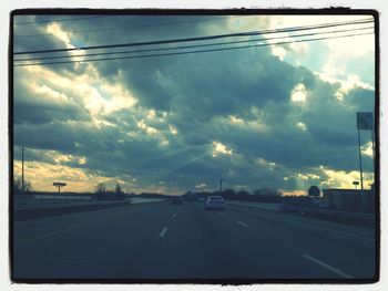 View of road against cloudy sky