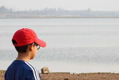 Rear view of man looking at sea