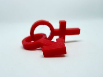 Close-up of red toy over white background