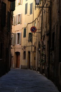 Alley amidst buildings in city