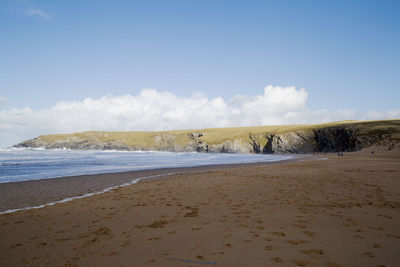 Scenic view of beach against sky