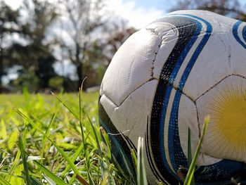 Close-up of soccer ball on field