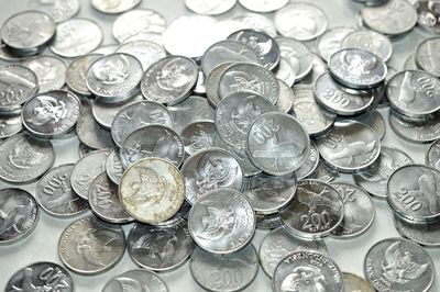 High angle view of coins on table