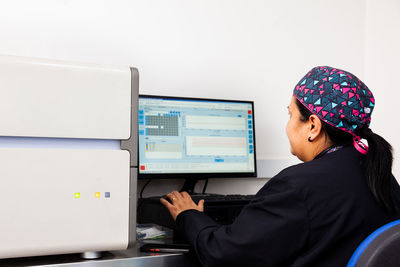 Scientist working at the laboratory with a thermal cycler. real-time polymerase chain reaction.