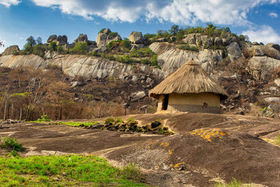 Built structure on land against sky