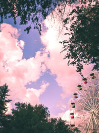 Low angle view of ferris wheel against sky