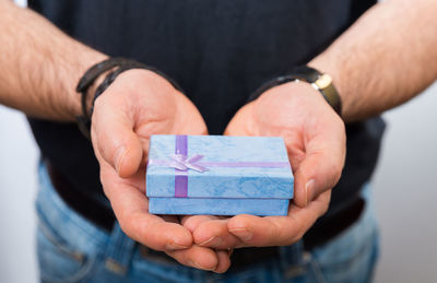 Close-up of man holding box