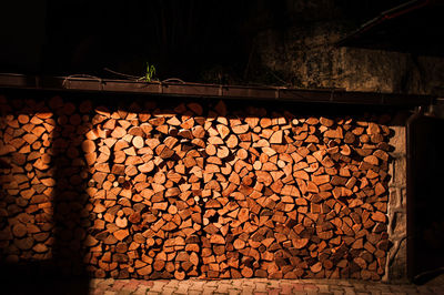 Stack of logs in darkroom