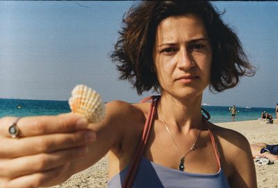 Portrait of young woman eating food