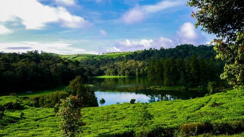 Scenic view of lake against cloudy sky