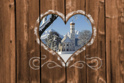 Close-up of heart shape against building