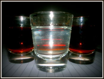 Close-up of wine glasses on table