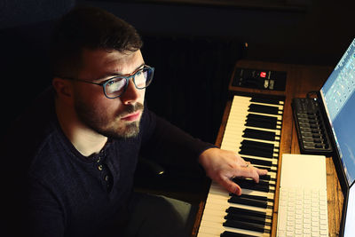 Portrait of man playing piano