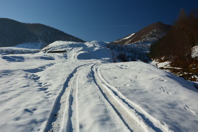 Snow covered mountain against sky