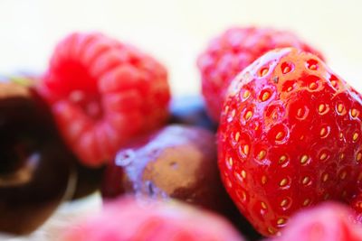 Close-up of strawberry over white background