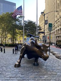 Horse sculpture on street in city