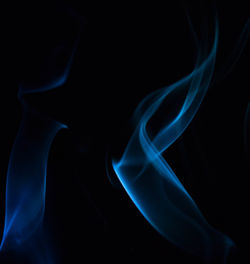 Close-up of light painting against black background