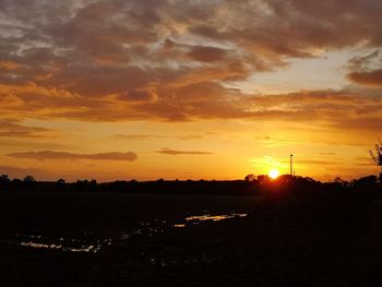 Scenic view of silhouette landscape against sky during sunset