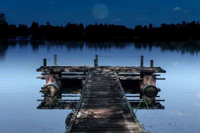 Lifeguard hut against sky at night
