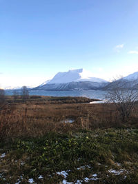 Scenic view of snowcapped mountains against sky