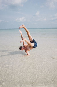 Man performing stunt in sea