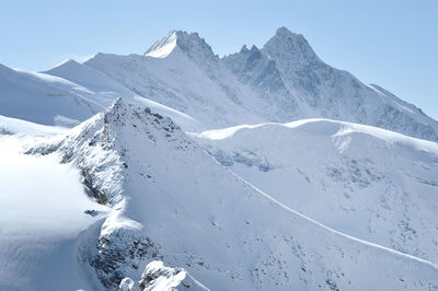 Alpine snow covered peak in the alps at winter