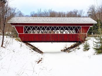 Built structure in winter against sky