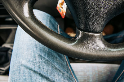 Low section of man in car