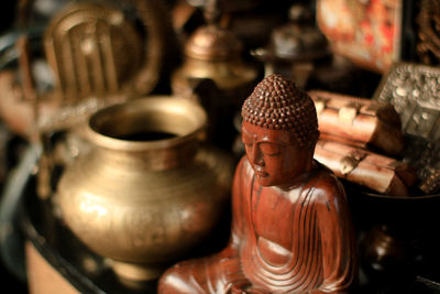 Close-up of buddha statue against building