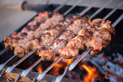 Close-up of meat on barbecue grill