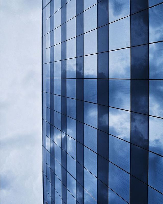 architecture, modern, built structure, building exterior, office building, low angle view, glass - material, reflection, sky, skyscraper, city, tall - high, building, tower, cloud - sky, window, glass, day, no people, pattern
