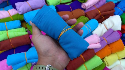 Cropped hand holding colorful fabric