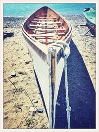 Deck chairs on sand at beach