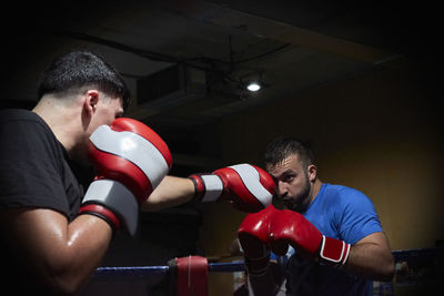 Two boxers training on a ring