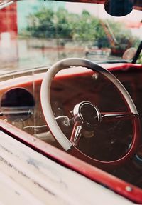 Close-up of reflection on side-view mirror