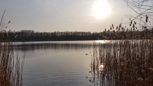 Scenic view of lake against sky during sunset