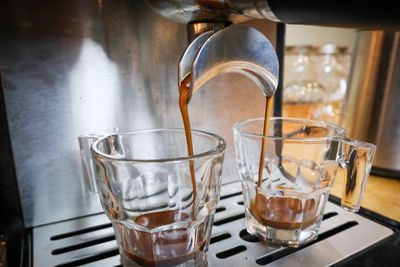 Coffee cups in glass