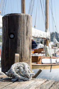 Close-up of sailboats moored at harbor