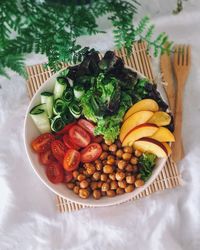 High angle view of fruits in plate on table