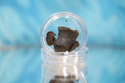 Close-up of cannabis in glass containers