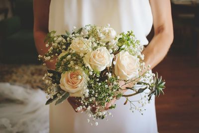 Close-up of woman holding bouquet