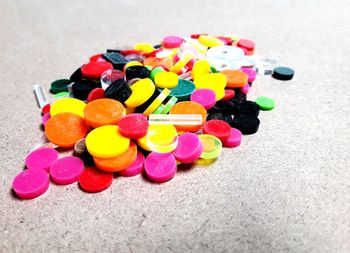 High angle view of multi colored candies on table