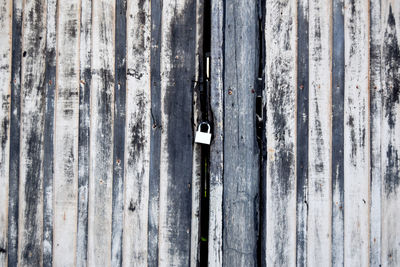 Full frame shot of weathered wooden door