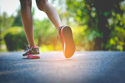 Low section of woman running